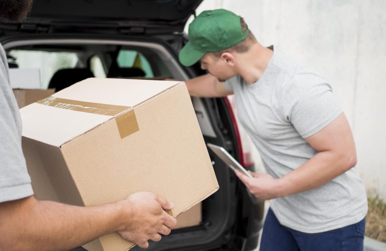 close-up-delivery-man-holding-clipboard